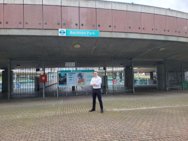 Freddie Downing standing outside Beckton Park DLR station
